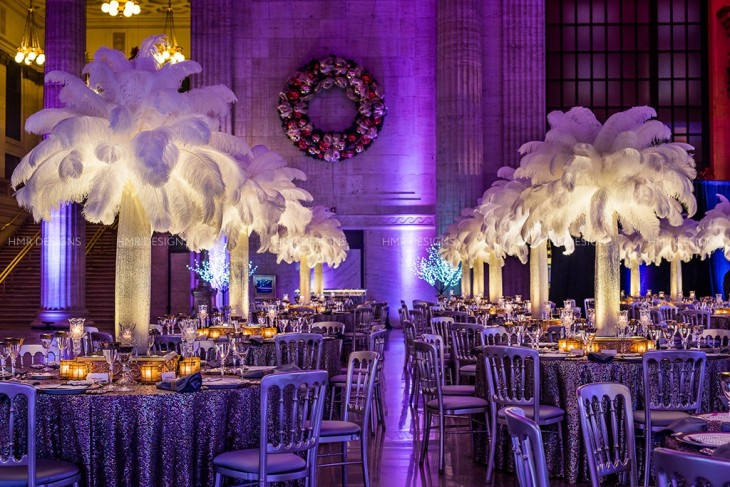 Guests dine among illuminated plumes and rich light. Photo by Kent Drake Photography.