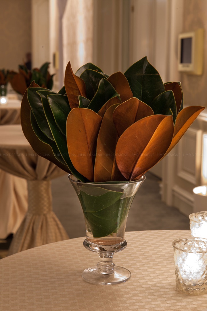 magnolia-leaves-in-centerpieces-for-a-wedding-by-hmr-designs