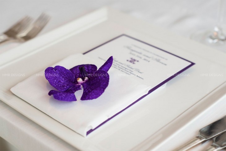 a-single-orchid-blossom-completes-a-place-setting-at-a-modern-chicago-wedding-by-hmr-designs